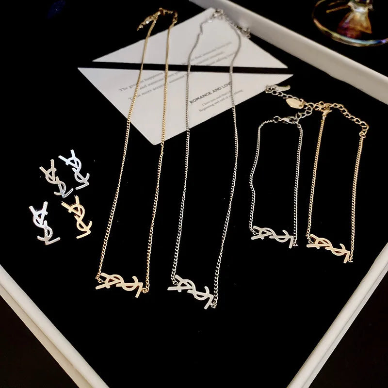 Niche fashion light luxury temperament earrings silver needle metal style letter earrings French simple high-end feeling earring